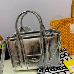 Marc Jacobs tote silver. I literally carry this bag for one day,
